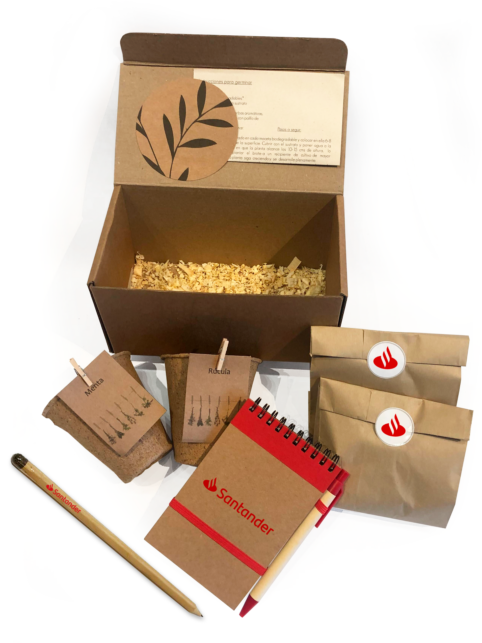 Kit ecológico para regalos empresariales incluye macetas biodegradables, lápiz plantable, libreta y lapicera ecológicas, semillas y dos bolsitas de tierra. Incluye instrucciones de germinación y se presenta en una caja con viruta