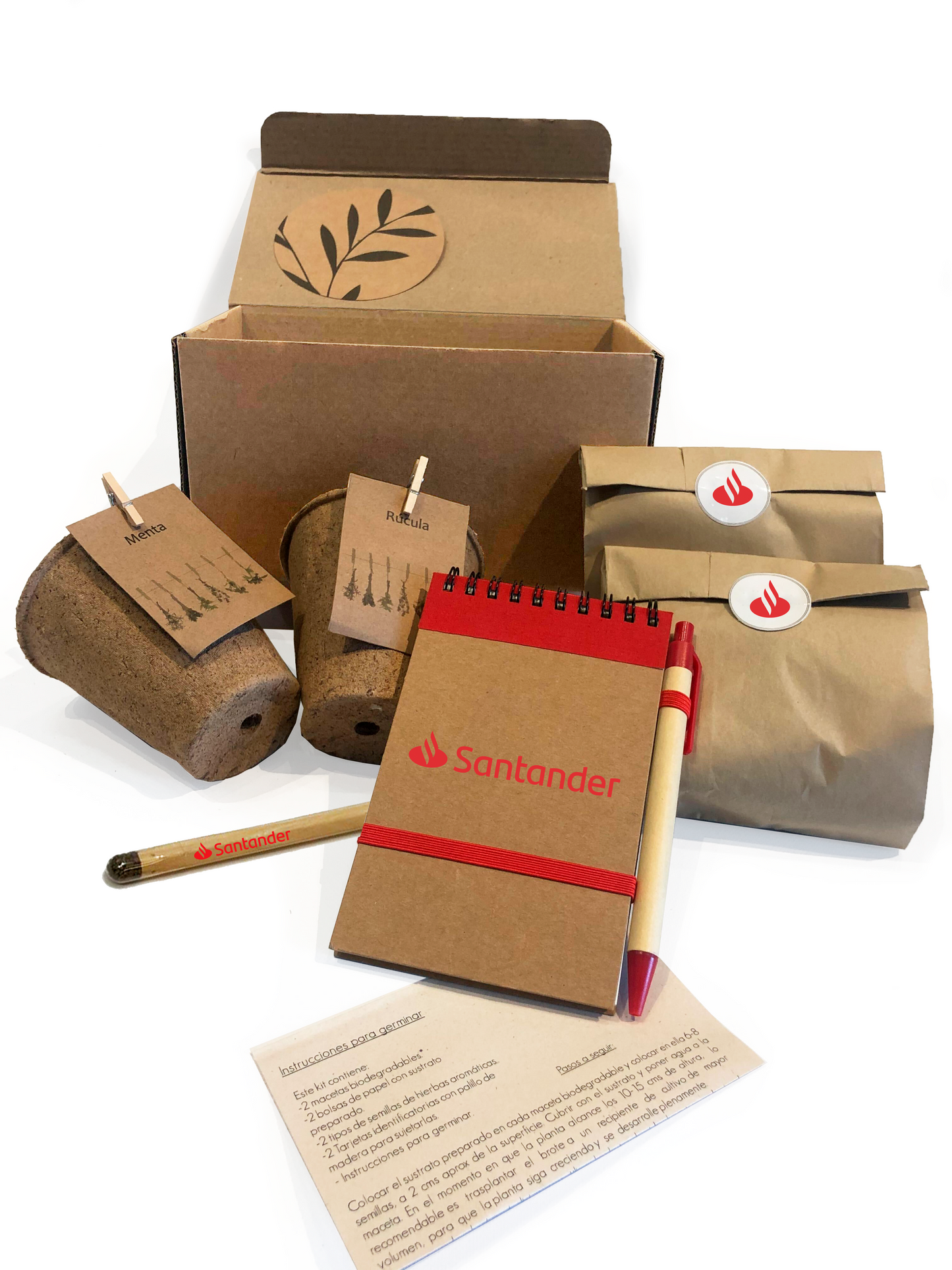 Kit ecológico para regalos empresariales incluye macetas biodegradables, lápiz plantable, libreta y lapicera ecológicas, semillas y dos bolsitas de tierra. Incluye instrucciones de germinación y se presenta en una caja con viruta