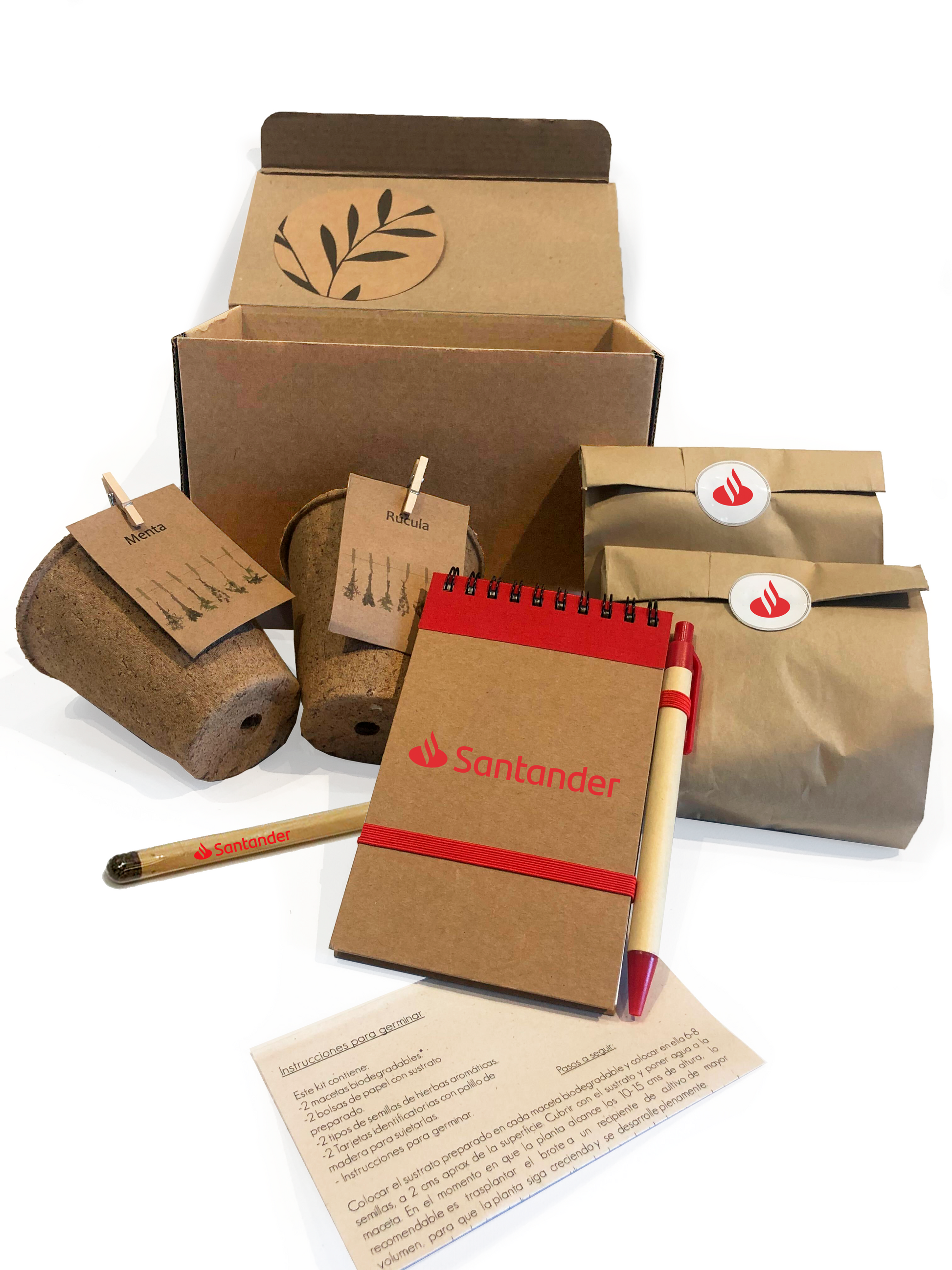 Kit ecológico para regalos empresariales incluye macetas biodegradables, lápiz plantable, libreta y lapicera ecológicas, semillas y dos bolsitas de tierra. Incluye instrucciones de germinación y se presenta en una caja con viruta